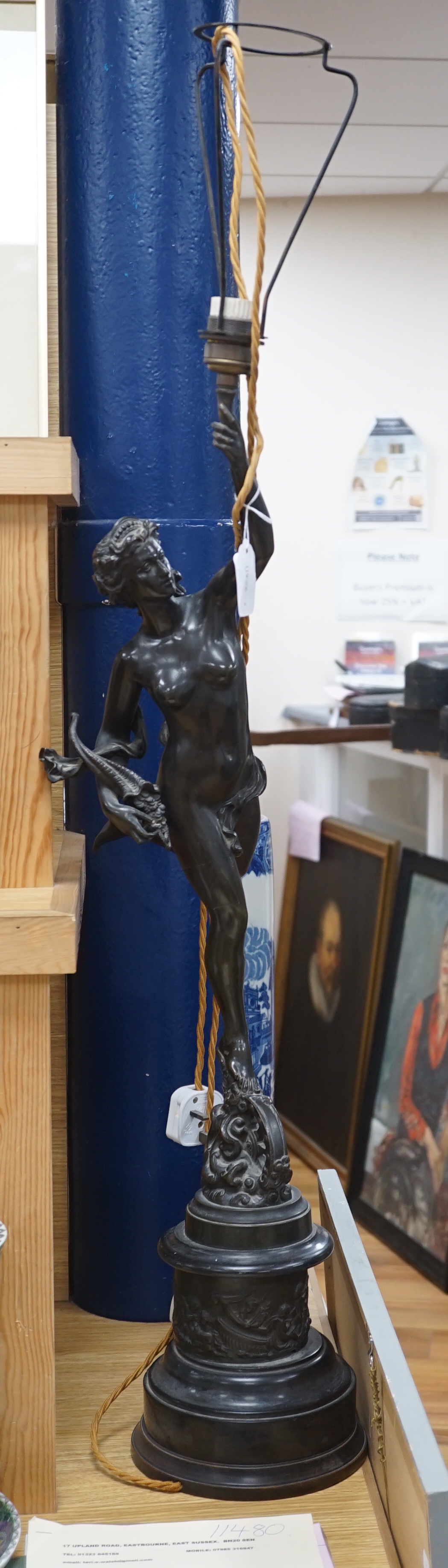 After Giambologna. A bronze model of Fortune mounted as a lamp, 85cm to finger tips